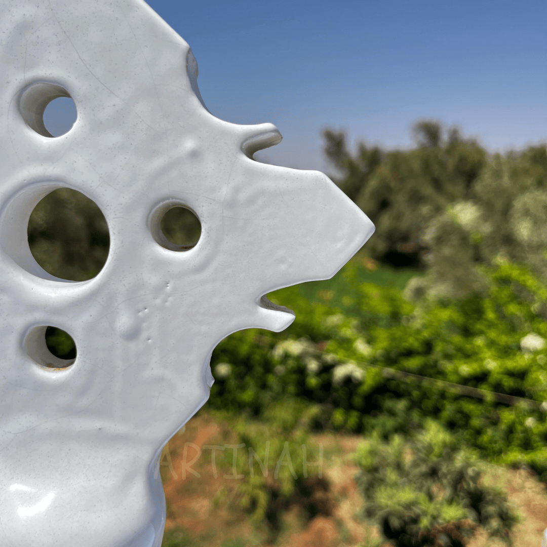 Handcrafted White Ceramic Sculpture with Geometric Cut-Out Design