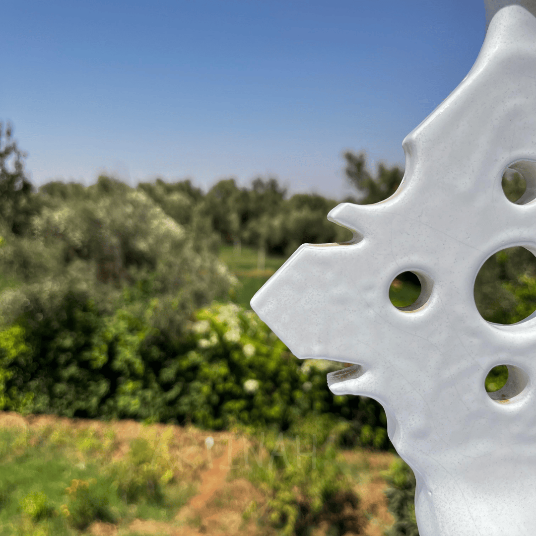 Handcrafted White Ceramic Sculpture with Geometric Cut-Out Design